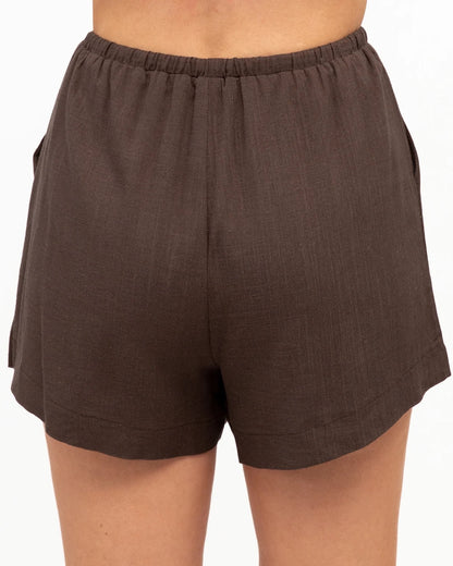 A gorgeous brown top and shorts set made for everyday comfort and effortless style. Soft, easy to wear and perfect for everyday adventures, this versatile set can be worn together or styled separately for endless outfit options.

V neckline
Adjustable thin straps
Pleat detail
Front tuck design
Mid-rise waist
Elastic waist with tie
Side pockets
Mini length
Relaxed fit
Lined
Fabric: cotton polyetser