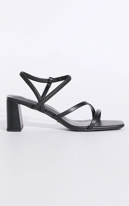 Hennie is your new staple strappy heel, available exclusively to Billini.

Step into effortless elegance with the Hennie heel - a modern classic designed to elevate every look. Delicate straps wrap gracefully around the foot, creating a barely-there silhouette that’s both bold and feminine.