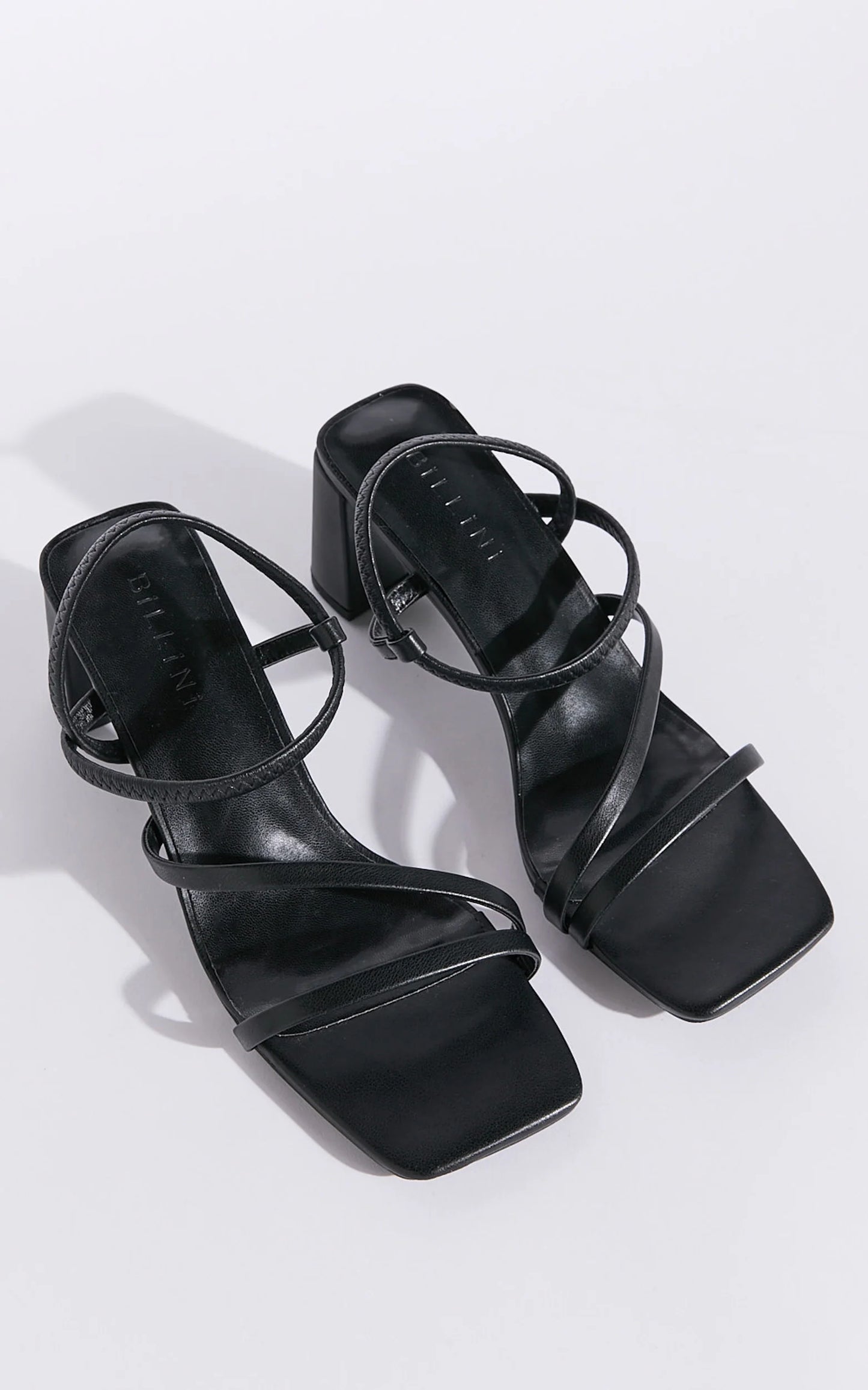 Hennie is your new staple strappy heel, available exclusively to Billini.

Step into effortless elegance with the Hennie heel - a modern classic designed to elevate every look. Delicate straps wrap gracefully around the foot, creating a barely-there silhouette that’s both bold and feminine.