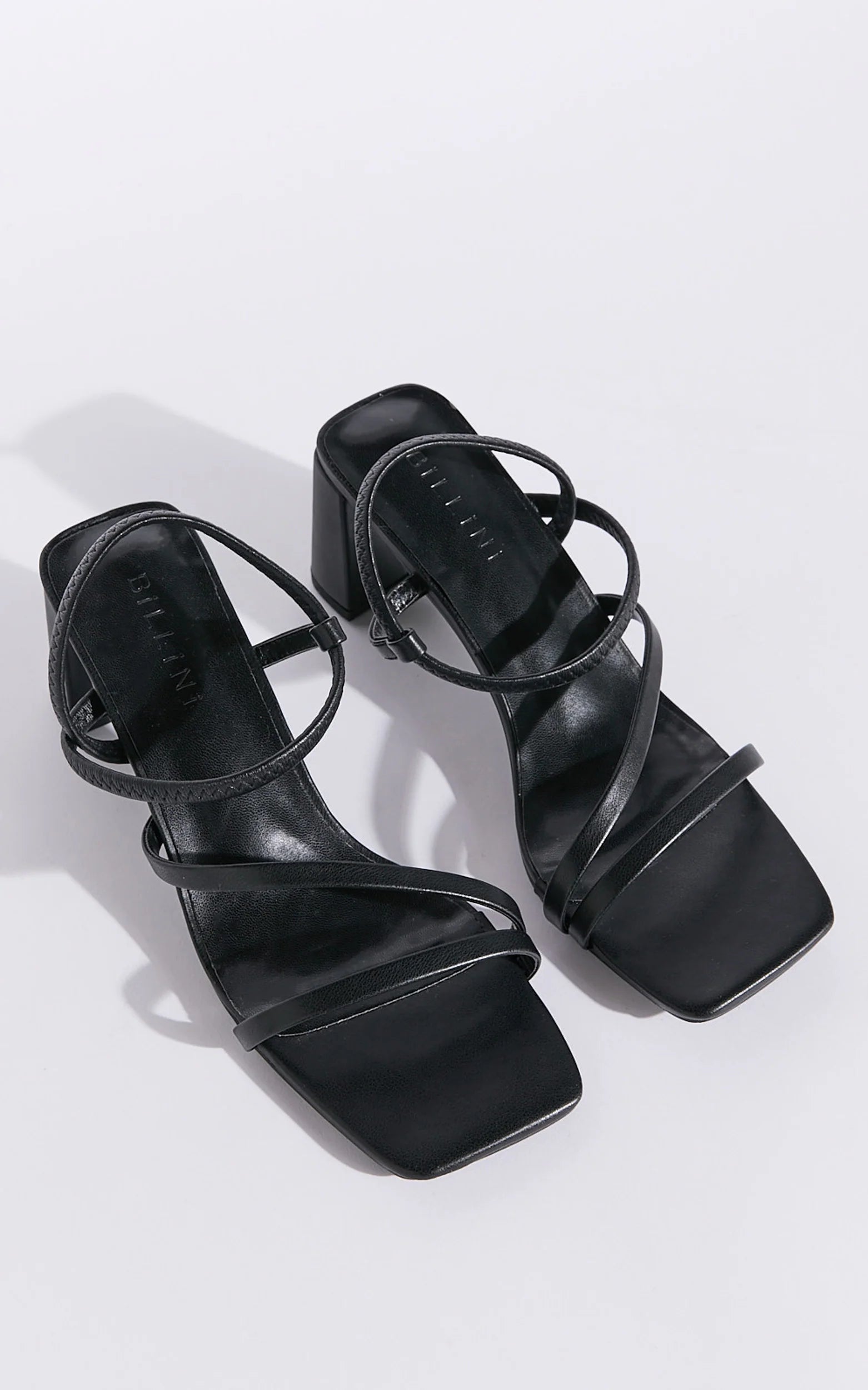 Hennie is your new staple strappy heel, available exclusively to Billini.

Step into effortless elegance with the Hennie heel - a modern classic designed to elevate every look. Delicate straps wrap gracefully around the foot, creating a barely-there silhouette that’s both bold and feminine.