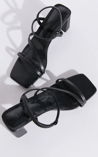 Hennie is your new staple strappy heel, available exclusively to Billini.

Step into effortless elegance with the Hennie heel - a modern classic designed to elevate every look. Delicate straps wrap gracefully around the foot, creating a barely-there silhouette that’s both bold and feminine.