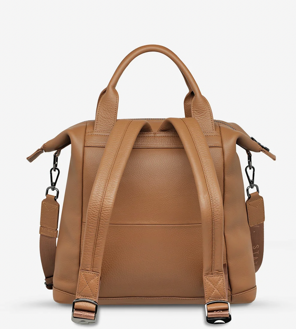 Mini waves Camel - Status Anxiety 

Made in response to the (very) popular request to make a smaller size version of our best selling 'Comes In Waves' bag. Mini Waves is the perfect uni or work bag with a wide opening top, space for your laptop and multiple compartments to keep everything in its place. Carry in hand with the top straps, over the body with the long webbed strap (included), or on your back with the shoulder straps. Big enough to carry everything you need, not too big to slow you down.