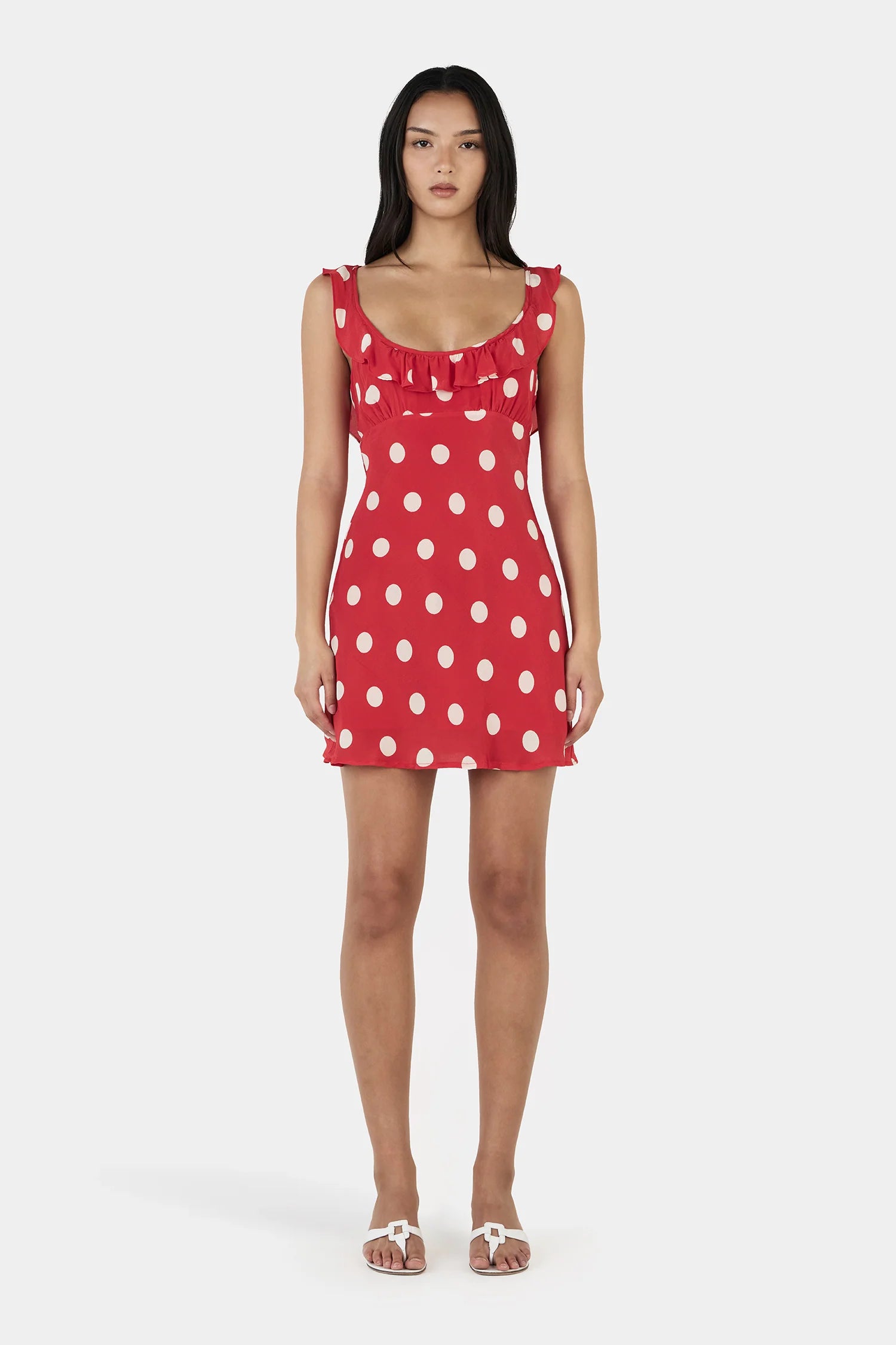 Say hello to your instant “cute without trying” era.

The Ownley Candy Mini Dress – Red Polka is the kind of piece that does all the flirting for you. Cut on the bias for that soft, body-skimming drape, it moves with you in the most effortless way—light, playful, and just a little bit cheeky. The bold red polka dot print brings main-character energy, while the scooped frill neckline adds a sweet, feminine touch that feels flirty without overdoing it.