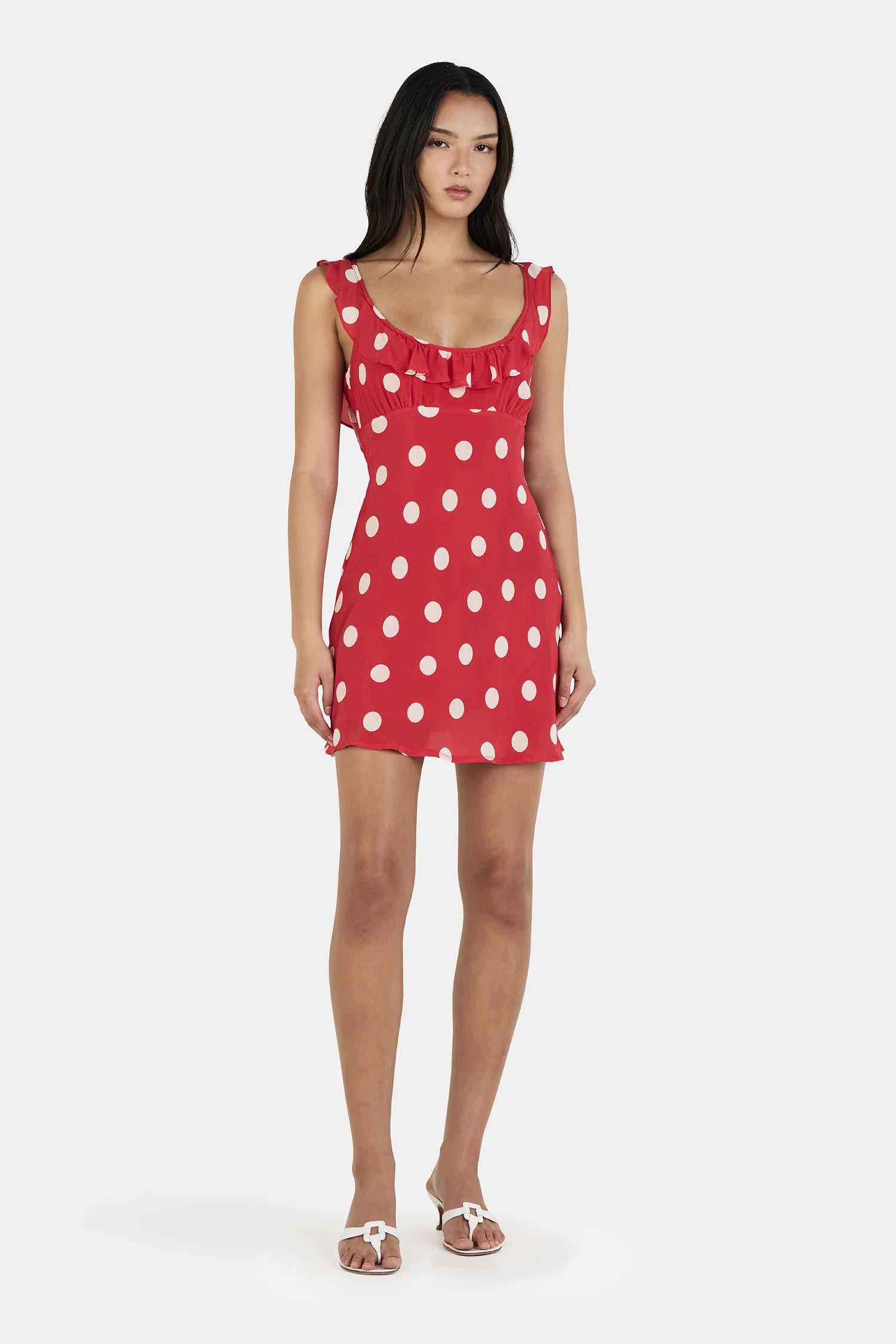 Say hello to your instant “cute without trying” era.

The Ownley Candy Mini Dress – Red Polka is the kind of piece that does all the flirting for you. Cut on the bias for that soft, body-skimming drape, it moves with you in the most effortless way—light, playful, and just a little bit cheeky. The bold red polka dot print brings main-character energy, while the scooped frill neckline adds a sweet, feminine touch that feels flirty without overdoing it.