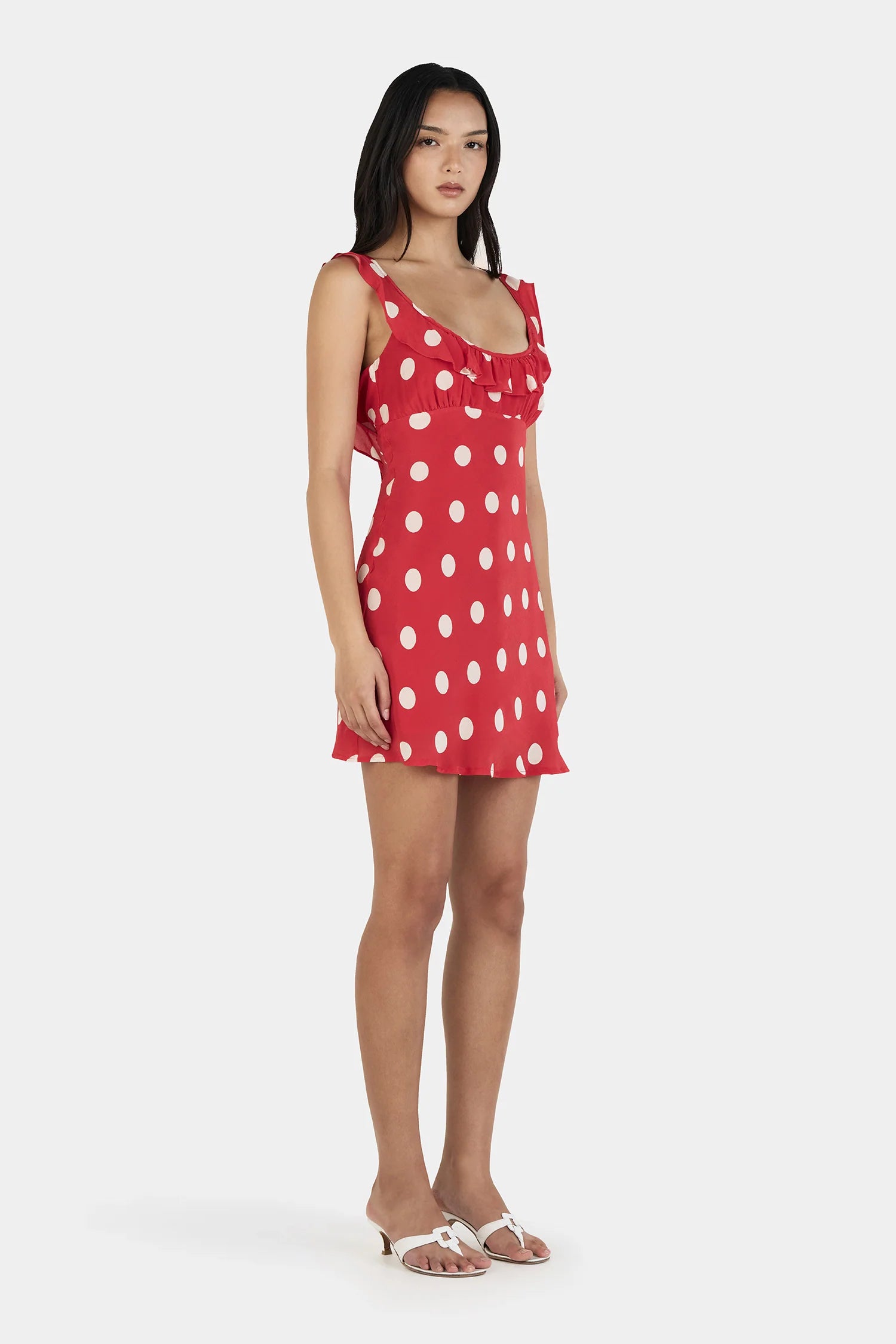 Say hello to your instant “cute without trying” era.

The Ownley Candy Mini Dress – Red Polka is the kind of piece that does all the flirting for you. Cut on the bias for that soft, body-skimming drape, it moves with you in the most effortless way—light, playful, and just a little bit cheeky. The bold red polka dot print brings main-character energy, while the scooped frill neckline adds a sweet, feminine touch that feels flirty without overdoing it.
