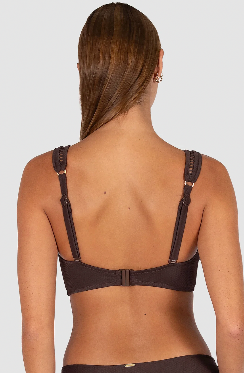 Baku Swimwear 

Crafted in Rococco — Baku's exclusive Spanish textural fabrication that's buttery soft yet beautifully structured — this longline bra top is one of the collection's most elegant styles, with ladder lace detailing at the neck and under the bust.

Best suited for D to DD cup sizes
V neckline with ladder lace detailing at the neck and under the bust for a refined, feminine finish
Side boning for a lifted, sculpted silhouette
Soft removable cups for contouring and shaping
