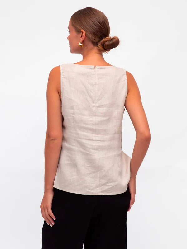 Stay cool and chic in this sleeveless tank. With a crew neckline, zipper in the back, and side splits, it's as functional as it is stylish. And did we mention it's made of luxurious linen fabric? You'll look and feel your best in the Linen Luxe Tank - Oatmeal.