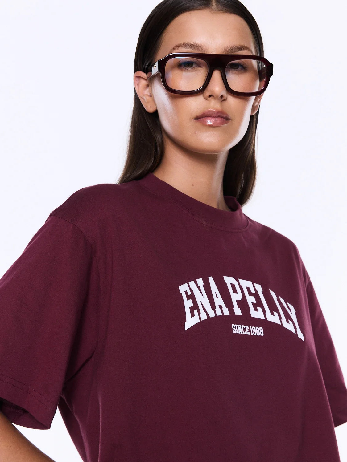 Ivy relaxed tee burgundy - Ena Pelly 

Everyday Cool. Effortless Edge. 
The Ivy Relaxed Tee is crafted from lightweight cotton jersey with a relaxed fit that blends comfort and street-inspired appeal. Finished with an exclusive collegiate-inspired Ena Pelly graphic in contrast plastisol print, bringing bold energy to an everyday staple.

Relaxed fit tee
Light weight cotton jersey
Crew neck
Short sleeve
Graphic designed exclusively in house
Model is 173cm and wears size 8