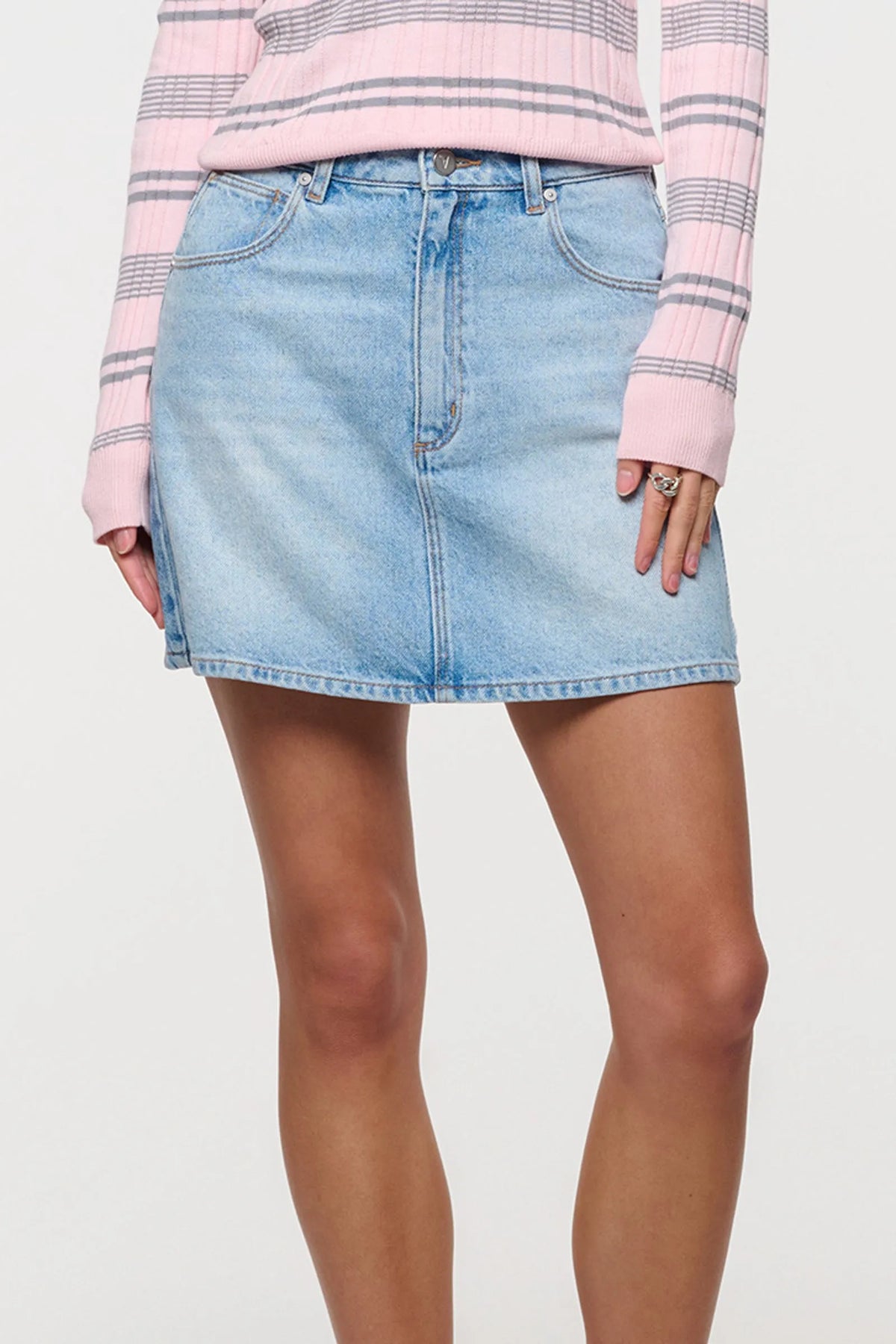 Features a flattering A-line silhouette that flares gently to create an effortless shape
Designed to sit high on the waist with a beautifully structured top block
Finished with classic five-pocket detailing, soft tobacco stitching, and a clean neatened hem
