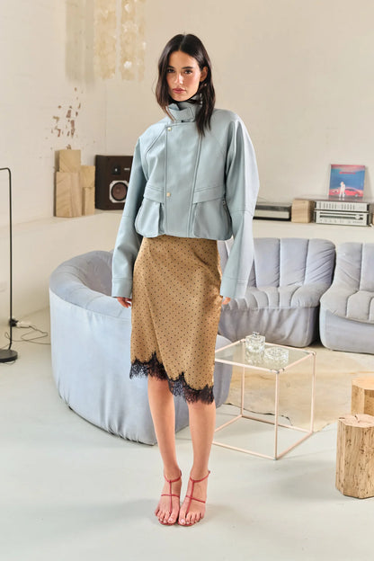 The Lucia Skirt by Madison The Label is an elegant mid rise design. This fitted midi skirt is mid rise and features a straight column silhouette. It is crafted in a polka dot printed satin fabrication with a contrast lace panel at hem. The hem has a scalloped edge adding a touch of uniqueness while maintaining it's feminine look with the lace detail. Pair with the Samira Top for the complete look.

Hope is wearing a size XS (AU6). She is 180cm (5'11), has a 58cm bust, 58cm waist, and 89cm hips.