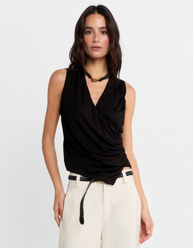 Elevate your wardrobe with the Jenkins Top from Madison The Label. A chic V-neck jersey top featuring a draped wrap front and an asymmetric hem. This top offers a flattering and stylish fit that's both comfortable and stylish. Perfect for pairing with everything from tailored trousers to your favorite jeans, it’s versatile enough for both work and weekend looks.

Hope is wearing a size small. She is 180cm (5'11) tall, has an 76cm bust, 58cm waist and 89cm hips.