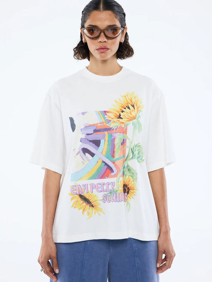 Radiant charm meets effortless style. 

The Sunflower Warp Tee by Ena Pelly is your new everyday mood-lifter. Made from soft cotton jersey, this tee offers an oversized, relaxed fit for ultimate comfort and easy layering. Its vibrant, retro-inspired warp graphic paired with bold sunflower illustrations brings nostalgic energy with a modern twist. The classic crew neckline and lived-in feel make it a go-to for weekend adventures, casual days, or layering under jackets for extra flair.