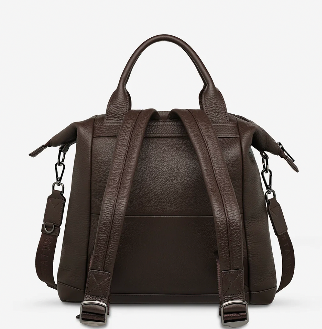 Mini waves Cocoa - Status Anxiety 

Made in response to the (very) popular request to make a smaller size version of our best selling 'Comes In Waves' bag. Mini Waves is the perfect uni or work bag with a wide opening top, space for your laptop and multiple compartments to keep everything in its place. Carry in hand with the top straps, over the body with the long webbed strap (included), or on your back with the shoulder straps. Big enough to carry everything you need, not too big to slow you down.