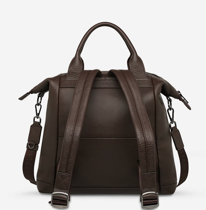 Mini waves Cocoa - Status Anxiety 

Made in response to the (very) popular request to make a smaller size version of our best selling 'Comes In Waves' bag. Mini Waves is the perfect uni or work bag with a wide opening top, space for your laptop and multiple compartments to keep everything in its place. Carry in hand with the top straps, over the body with the long webbed strap (included), or on your back with the shoulder straps. Big enough to carry everything you need, not too big to slow you down.