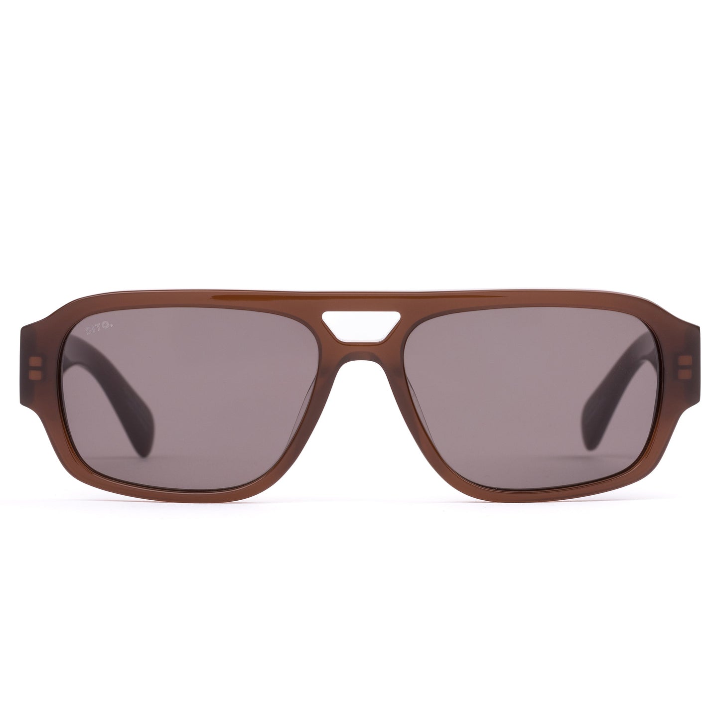 ATLAS : MILKY COCO SITO
Built like it's already won the argument. 

Perfect for: Airport lounges, big meetings, and a presence that precedes you. 

Translucent Brown Acetate Frame
CR39 Grey Lenses
100% UV Protection  
Silver Hardware  
Best suited to round and oval faces. 
 

Frame Shape: Aviator  

Frame Type: Acetate 

Lens Material: CR39 

Lens Type: Polarised 

Lens Treatment: Solid 

Lens Colour: Iron Grey Polar (Cat 3) 