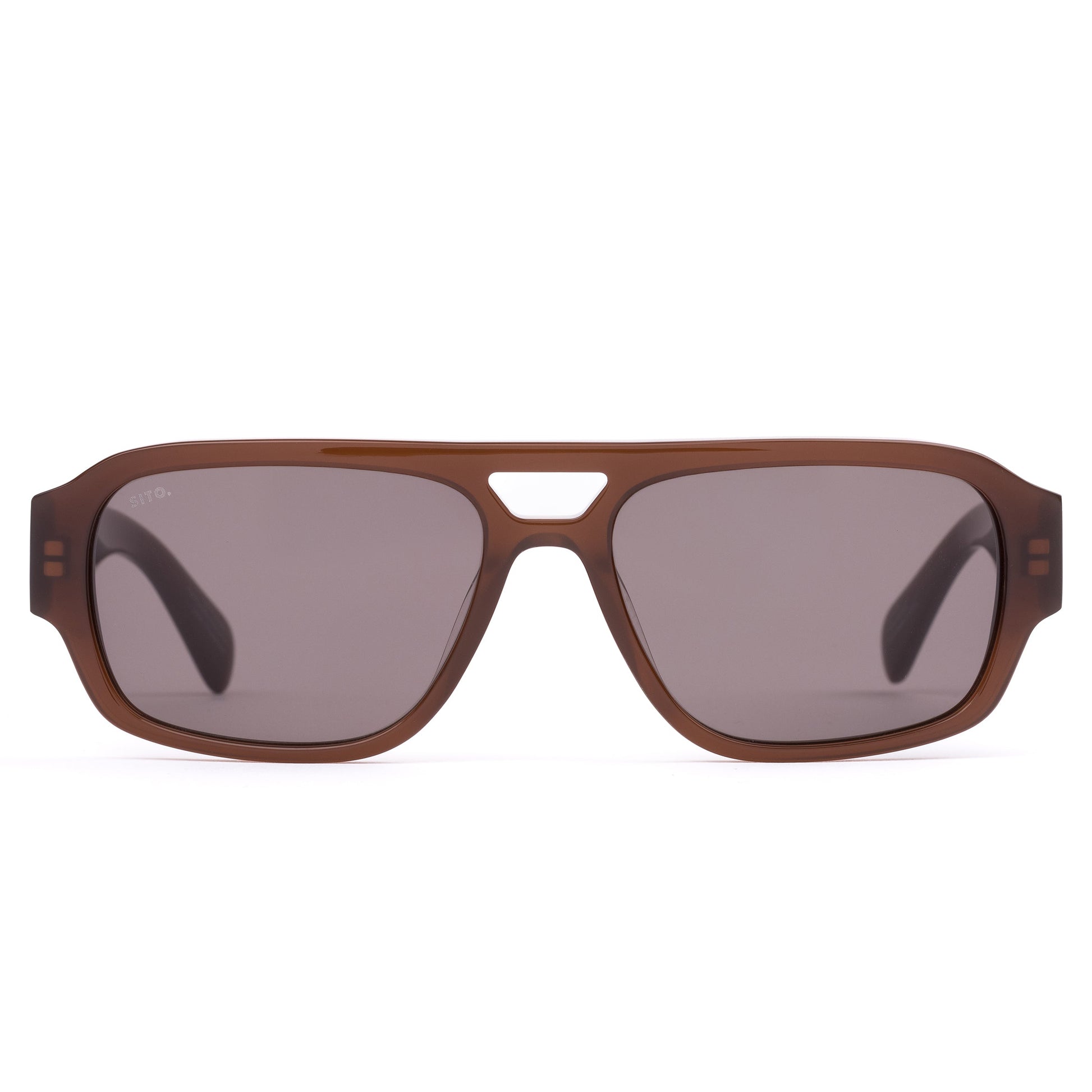 ATLAS : MILKY COCO SITO
Built like it's already won the argument. 

Perfect for: Airport lounges, big meetings, and a presence that precedes you. 

Translucent Brown Acetate Frame
CR39 Grey Lenses
100% UV Protection  
Silver Hardware  
Best suited to round and oval faces. 
 

Frame Shape: Aviator  

Frame Type: Acetate 

Lens Material: CR39 

Lens Type: Polarised 

Lens Treatment: Solid 

Lens Colour: Iron Grey Polar (Cat 3) 