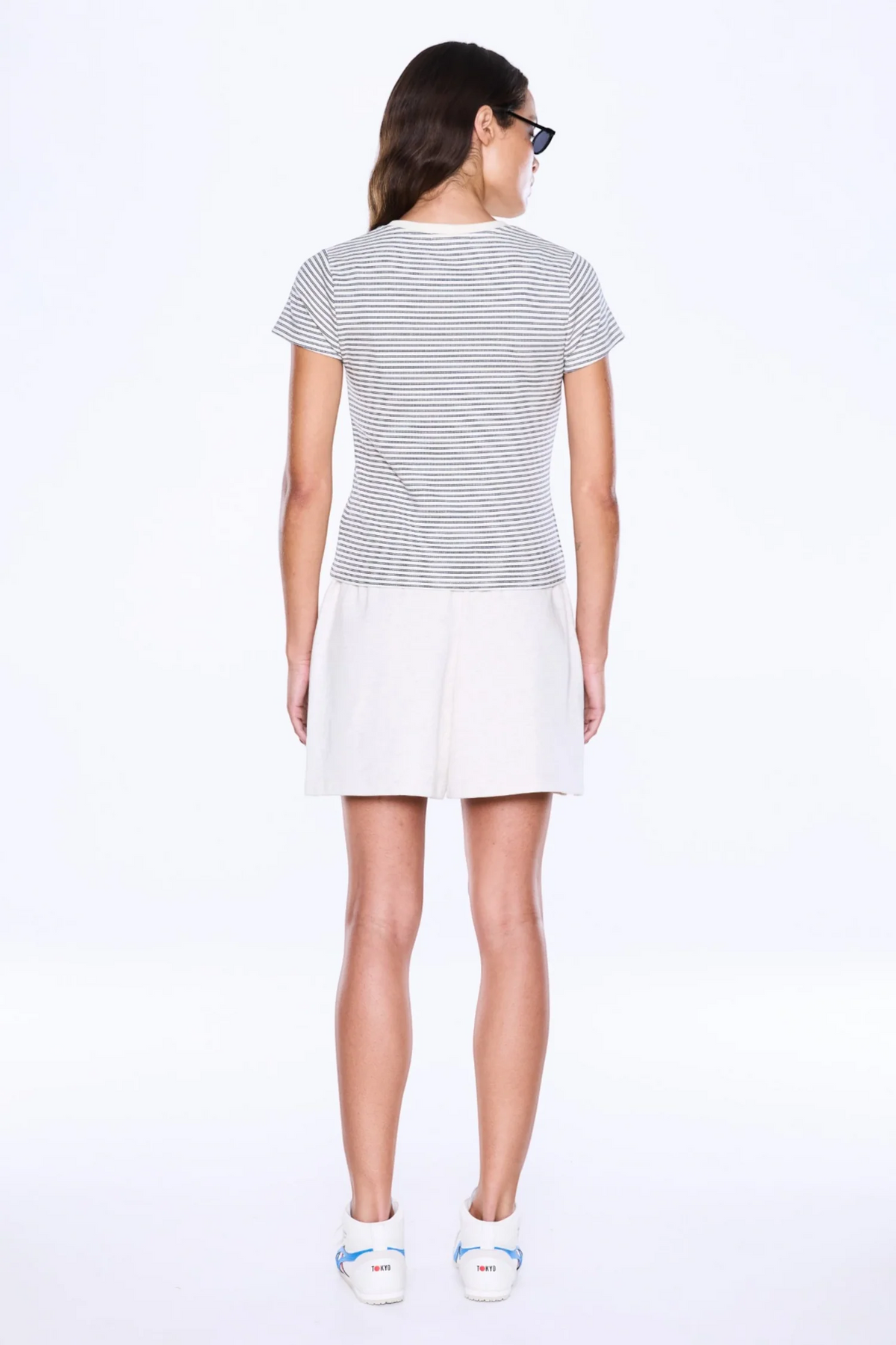 Bold Lines. Casual Rhythm.
The Penny Baby Tee from Ena Pelly is made from soft cotton baby rib with added stretch in a fitted cropped silhouette that hugs the body with ease. Designed with cap sleeves, a crew neckline, striped detailing and a branded woven badge for an elevated everyday finish.