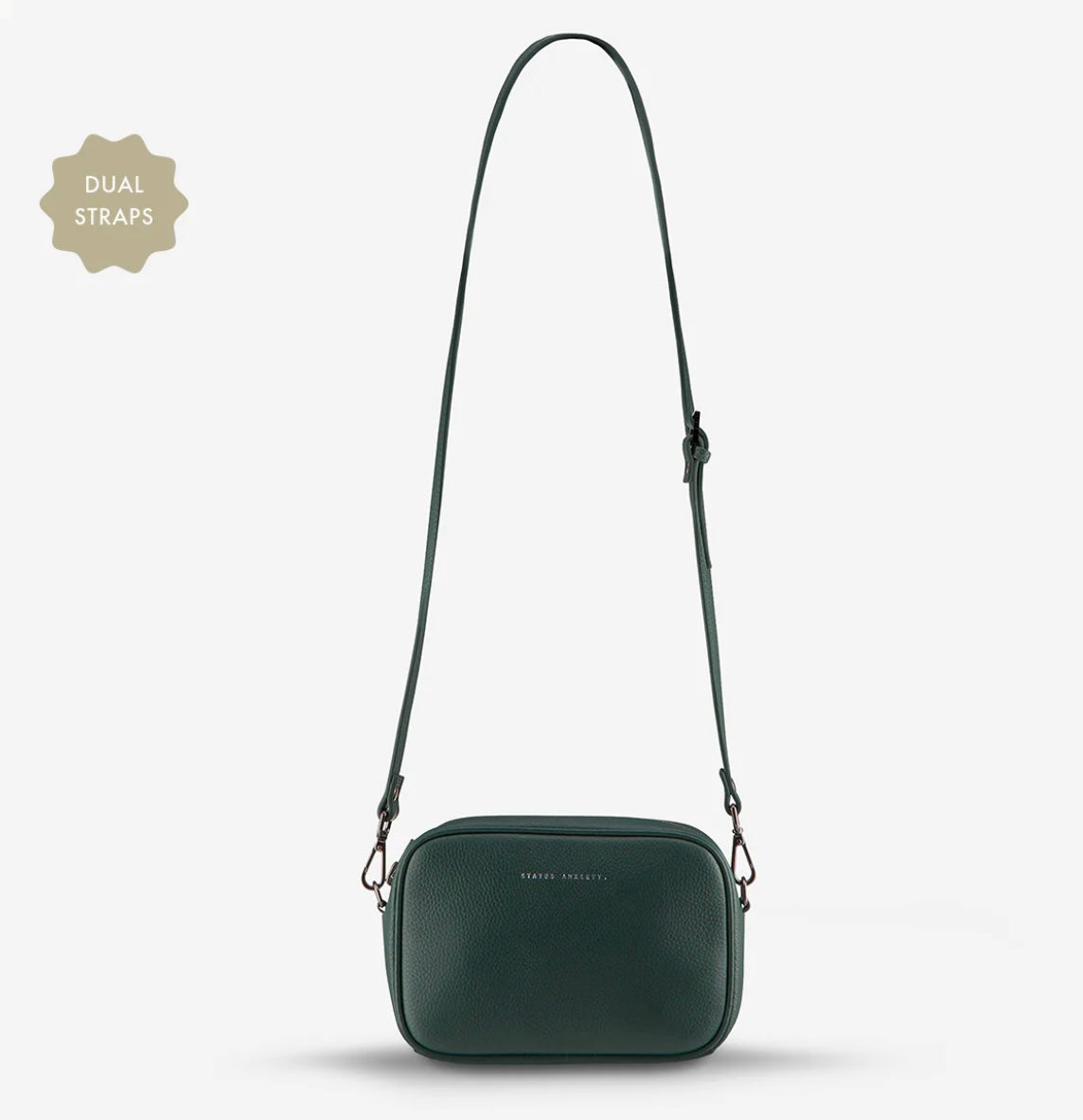Plunder Bag With Dual Straps - Green - Status Anxiety 

Our best selling bag of all time now comes with two different straps for twice the versatility. Clip on the leather strap for dressier occasions, or the webbed strap for a more casual vibe. It's a no brainer.

Soft shrunken pebble leather
Comes with Leather Strap Thin & Web Strap Medium
Back slider pocket
Internal zipper pocket, and open pouch pockets
Zipper close
Custom Status Anxiety lining
Comes in a Status Anxiety branded drawstring bag