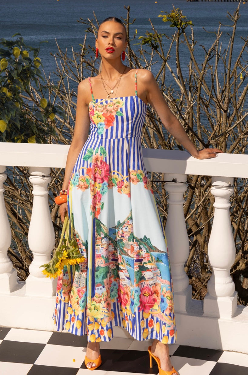 Say hello to your summer state of mind, bottled into a dress.

The Mia Milani Positano Sundress in Blue is made for golden days, salty air, and that “I feel amazing without even trying” energy. With its dreamy coastal-inspired print, it instantly transports you somewhere sun-soaked by the sea, even if you’re just heading out for brunch.