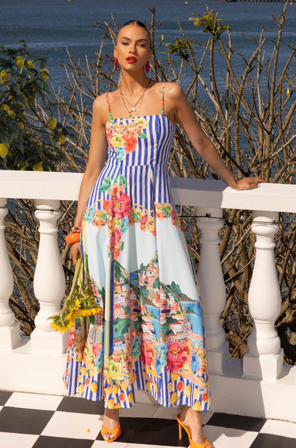 Say hello to your summer state of mind, bottled into a dress.

The Mia Milani Positano Sundress in Blue is made for golden days, salty air, and that “I feel amazing without even trying” energy. With its dreamy coastal-inspired print, it instantly transports you somewhere sun-soaked by the sea, even if you’re just heading out for brunch.