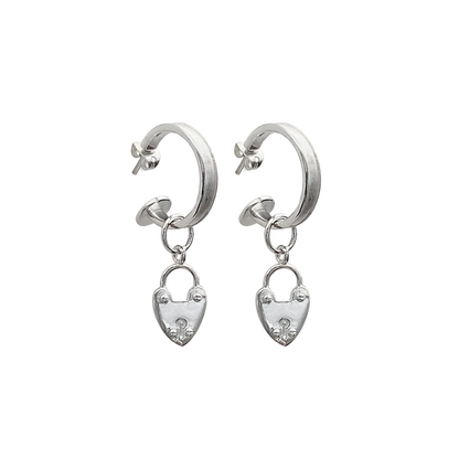Our beloved Heart Mini Hoops, now in silver, are a perfect addition to any outfit. Whether worn with our&nbsp;gorgeous heart locket charms or solo, yes the charms are removable! These mini&nbsp;silver hoops are&nbsp;such a cute &amp; eye-catching accessory.&nbsp;Maybe you're running errands, attending a special event, or exercising, these&nbsp;small but mighty earrings are a perfect complement to your look. They're your go-to everyday earring that are never boring.&nbsp;