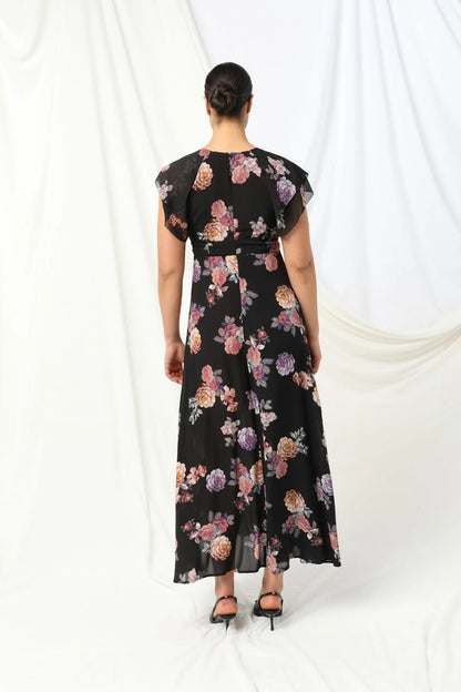 Introducing the Marilyn Maxi Dress by KACHEL - a total showstopper with a fun, flirty twist.
With a deep V-neckline, soft ruffled sleeves, and a ruffled split, this dress is all about movement, style, and feel-good vibes. Splashed in colours and a florals, it strikes the perfect balance between elegance and fun. Whether you're heading to a summer party, a garden wedding, or just want to feel amazing, this beauty is guaranteed to turn heads and brighten your day.

Maxi length
Ruffled short sleeves
V-neckline