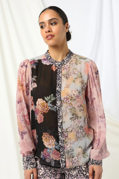 Mackenzie Shirt - Kachel
Meet the Mackenzie Shirt by Kachel - perfectly styled with the Julia Pant for a look that's effortlessly chic.

With its high collar neckline and long puffed sleeves finished with neat cuffs, it's got just the right amount of drama. The delicate floral print adds a lovely feminine touch, making it ideal for everything from workdays to weekend plans. Dress it up or keep it casual - either way, the Mackenzie Shirt brings timeless style with a modern twist.
