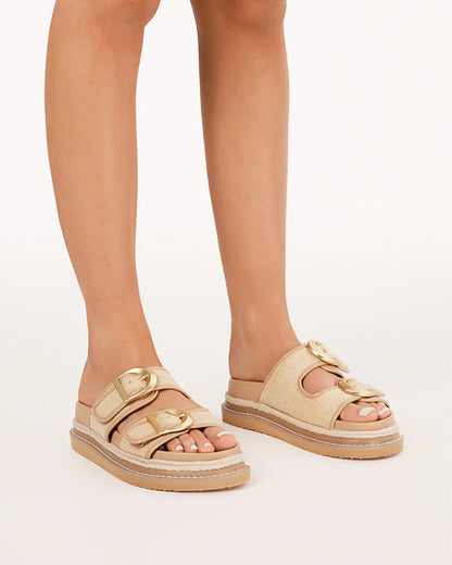 Anora Sandals - Billini 
Anora is a chunky platform sandal, available exclusively to Billini.

A striking platform sandal with chunky straps and buckle details, exuding bold, confident energy with a modern edge.

Featuring;

platform sole with statement rope detailing
open round toe
thick twin straps across upper
statement gold hardware buckle detailing
open heel counter
synthetic upper, lining and outsole