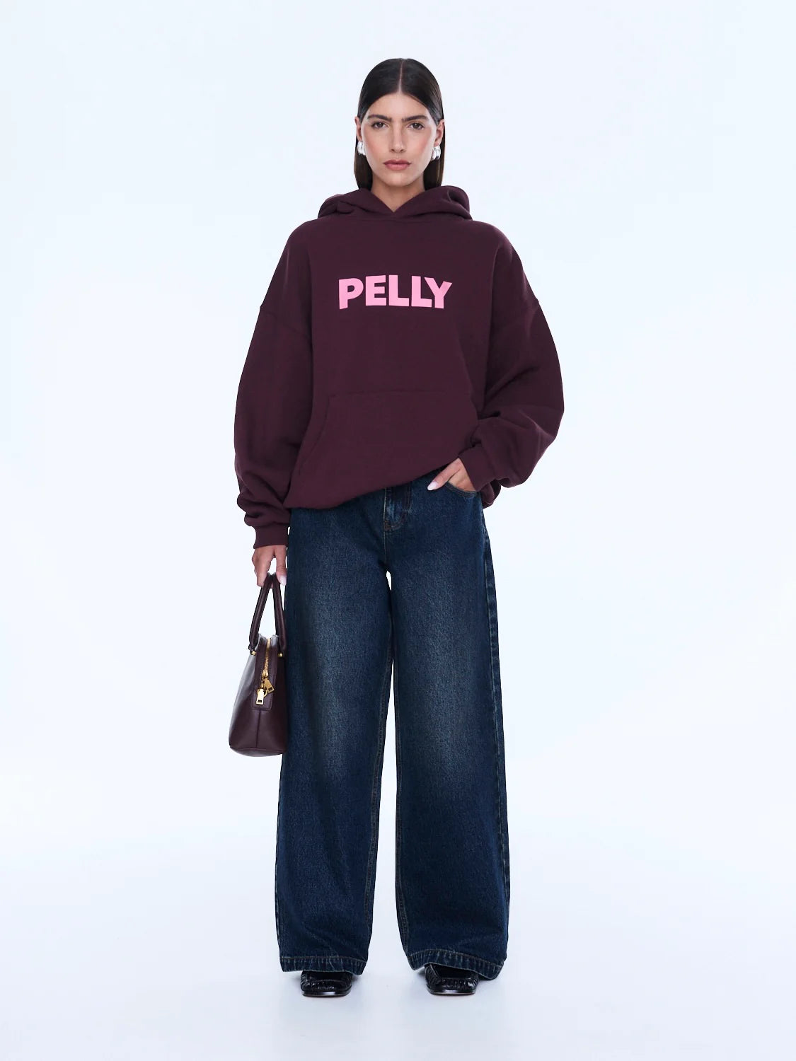 Street Energy. Everyday Ease. 
The Cassie Oversized Hoodie is cut from soft brushed cotton blend fleece in deep cherry red with an oversized silhouette and relaxed dropped shoulders. Finished with bold pop pink Pelly graphics across the chest for a playful statement grounded in everyday comfort.

Cotton rich brushed fleece hoodie
Oversized fit with drop shoulder
Self lined hood
In house graphic design
Rib cuffs and hem band
Model is 176cm and wears size 8
