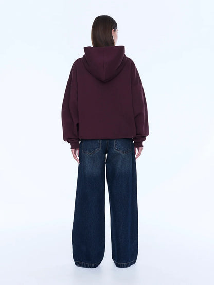 Street Energy. Everyday Ease. 
The Cassie Oversized Hoodie is cut from soft brushed cotton blend fleece in deep cherry red with an oversized silhouette and relaxed dropped shoulders. Finished with bold pop pink Pelly graphics across the chest for a playful statement grounded in everyday comfort.

Cotton rich brushed fleece hoodie
Oversized fit with drop shoulder
Self lined hood
In house graphic design
Rib cuffs and hem band
Model is 176cm and wears size 8