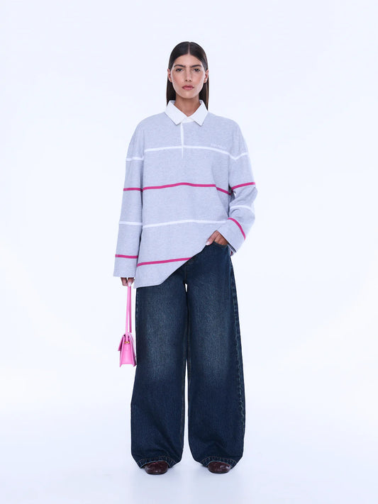 
Relaxed Shape. Subtle Edge.
The Riley Polo is cut from soft cotton jersey in a relaxed long-sleeve silhouette with a concealed placket and contrast collar. Finished with side hem splits, sporty stripe detailing and Ena Pelly chest embroidery that lends a playful retro-inspired feel.
Relaxed fit with long sleeve
Concealed placket
Side hem split
Self fabric stripe in contrast colours
Ena Pelly branding on chest
Model is 176cm and wears size 8