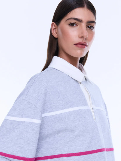 
Relaxed Shape. Subtle Edge.
The Riley Polo is cut from soft cotton jersey in a relaxed long-sleeve silhouette with a concealed placket and contrast collar. Finished with side hem splits, sporty stripe detailing and Ena Pelly chest embroidery that lends a playful retro-inspired feel.
Relaxed fit with long sleeve
Concealed placket
Side hem split
Self fabric stripe in contrast colours
Ena Pelly branding on chest
Model is 176cm and wears size 8
