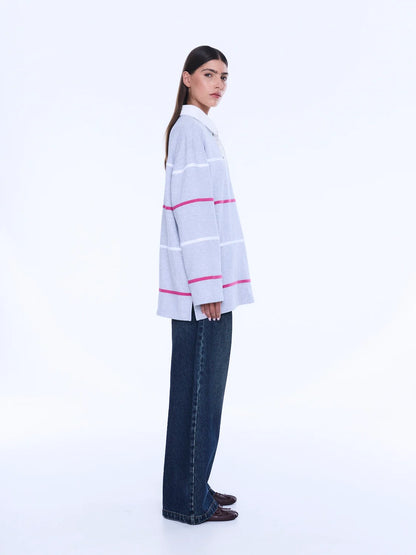 
Relaxed Shape. Subtle Edge.
The Riley Polo is cut from soft cotton jersey in a relaxed long-sleeve silhouette with a concealed placket and contrast collar. Finished with side hem splits, sporty stripe detailing and Ena Pelly chest embroidery that lends a playful retro-inspired feel.
Relaxed fit with long sleeve
Concealed placket
Side hem split
Self fabric stripe in contrast colours
Ena Pelly branding on chest
Model is 176cm and wears size 8