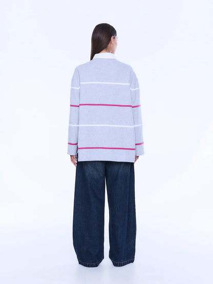 
Relaxed Shape. Subtle Edge.
The Riley Polo is cut from soft cotton jersey in a relaxed long-sleeve silhouette with a concealed placket and contrast collar. Finished with side hem splits, sporty stripe detailing and Ena Pelly chest embroidery that lends a playful retro-inspired feel.
Relaxed fit with long sleeve
Concealed placket
Side hem split
Self fabric stripe in contrast colours
Ena Pelly branding on chest
Model is 176cm and wears size 8