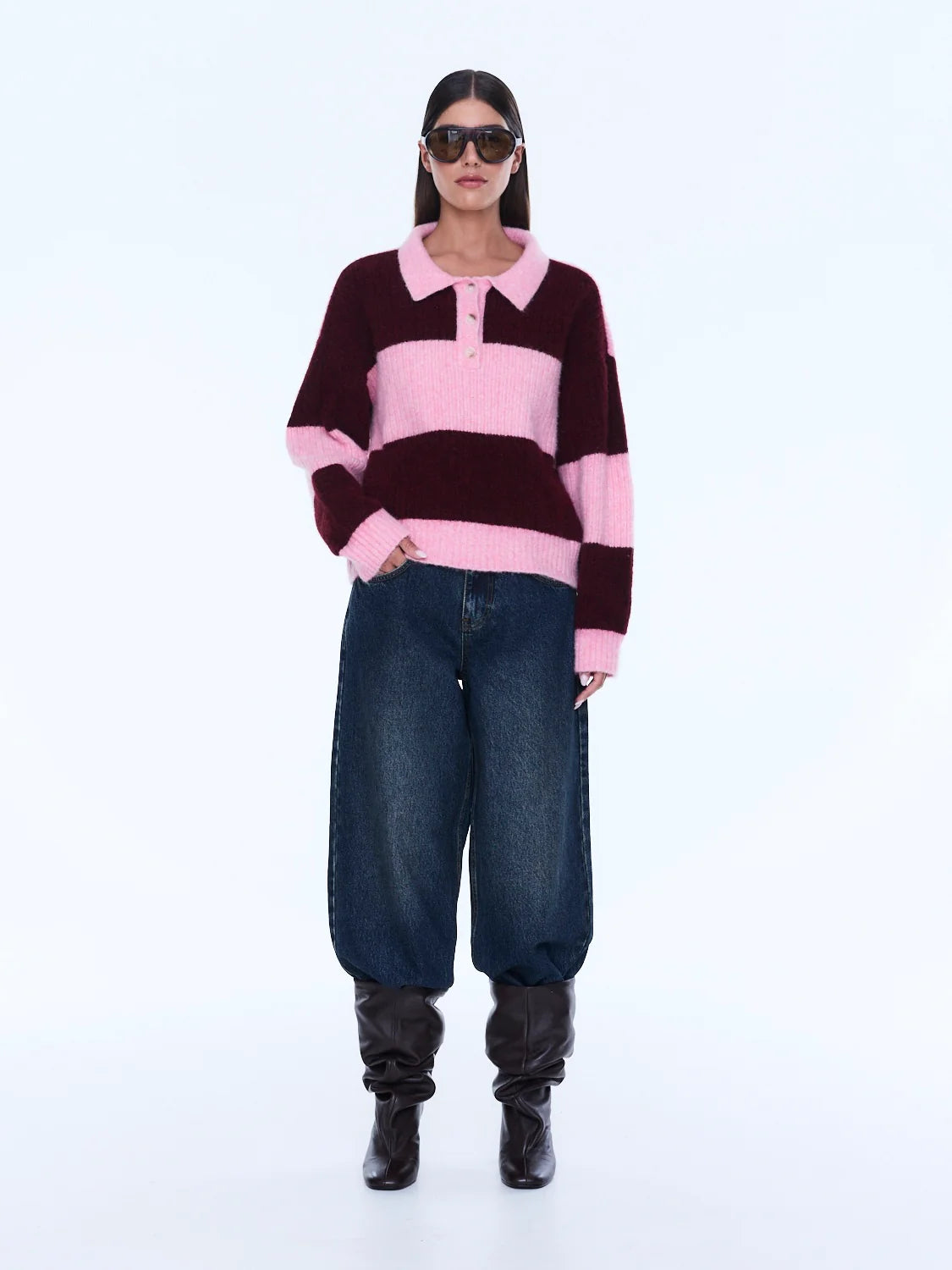 Mikaeka Knit Sweater - Ena Pelly 
Soft Texture. Confident Mood.
The Mikaela Knit Sweater is crafted from a soft alpaca and wool blend with a relaxed silhouette and dropped shoulders for effortless layering. Designed with contrast pink and cherry stripes, a polo-style collar and button placket that balance playful texture with elevated ease.

Relaxed fit
Collar
placket
Drop shoulder
Contrast stripe knit
Dual sizing
Model is 176cm and wears size XXS/XS