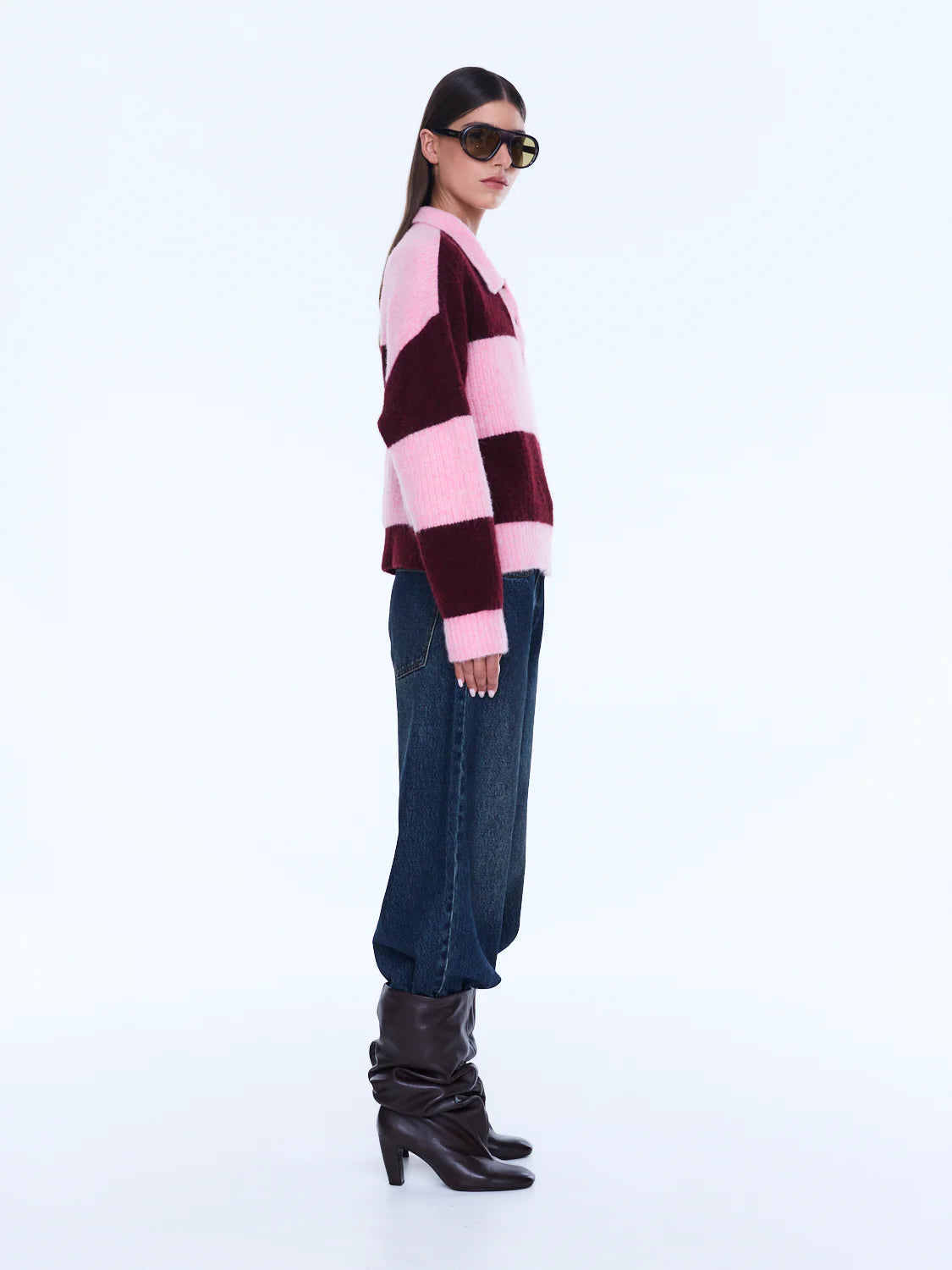 Mikaeka Knit Sweater - Ena Pelly 
Soft Texture. Confident Mood.
The Mikaela Knit Sweater is crafted from a soft alpaca and wool blend with a relaxed silhouette and dropped shoulders for effortless layering. Designed with contrast pink and cherry stripes, a polo-style collar and button placket that balance playful texture with elevated ease.

Relaxed fit
Collar
placket
Drop shoulder
Contrast stripe knit
Dual sizing
Model is 176cm and wears size XXS/XS