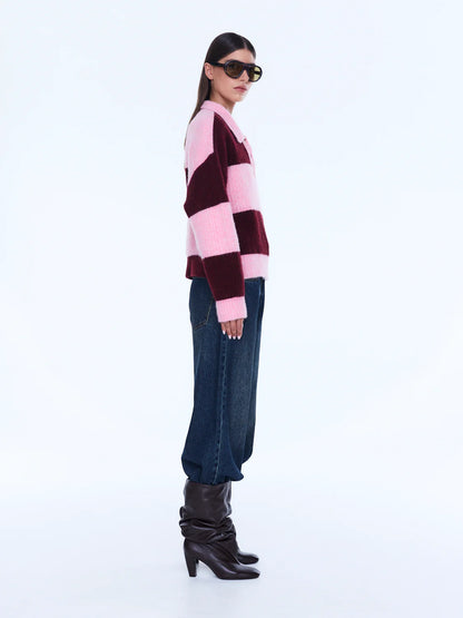 Mikaeka Knit Sweater - Ena Pelly 
Soft Texture. Confident Mood.
The Mikaela Knit Sweater is crafted from a soft alpaca and wool blend with a relaxed silhouette and dropped shoulders for effortless layering. Designed with contrast pink and cherry stripes, a polo-style collar and button placket that balance playful texture with elevated ease.

Relaxed fit
Collar
placket
Drop shoulder
Contrast stripe knit
Dual sizing
Model is 176cm and wears size XXS/XS