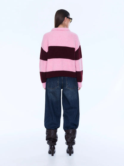 Mikaeka Knit Sweater - Ena Pelly 
Soft Texture. Confident Mood.
The Mikaela Knit Sweater is crafted from a soft alpaca and wool blend with a relaxed silhouette and dropped shoulders for effortless layering. Designed with contrast pink and cherry stripes, a polo-style collar and button placket that balance playful texture with elevated ease.

Relaxed fit
Collar
placket
Drop shoulder
Contrast stripe knit
Dual sizing
Model is 176cm and wears size XXS/XS
