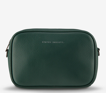 Plunder Bag With Dual Straps - Green - Status Anxiety 

Our best selling bag of all time now comes with two different straps for twice the versatility. Clip on the leather strap for dressier occasions, or the webbed strap for a more casual vibe. It's a no brainer.

Soft shrunken pebble leather
Comes with Leather Strap Thin & Web Strap Medium
Back slider pocket
Internal zipper pocket, and open pouch pockets
Zipper close
Custom Status Anxiety lining
Comes in a Status Anxiety branded drawstring bag