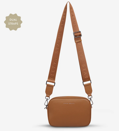 Plunder Bag With Duals Straps - Camel - Status Anxiety 

Our best selling bag of all time now comes with two different straps for twice the versatility. Clip on the leather strap for dressier occasions, or the webbed strap for a more casual vibe. It's a no brainer.

Soft shrunken pebble leather
Comes with Leather Strap Thin & Web Strap Medium
Back slider pocket
Internal zipper pocket, and open pouch pockets
Zipper close
Custom Status Anxiety lining
Comes in a Status Anxiety branded drawstring bag