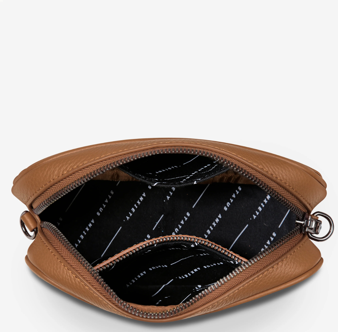 Plunder Bag With Duals Straps - Camel - Status Anxiety 

Our best selling bag of all time now comes with two different straps for twice the versatility. Clip on the leather strap for dressier occasions, or the webbed strap for a more casual vibe. It's a no brainer.

Soft shrunken pebble leather
Comes with Leather Strap Thin & Web Strap Medium
Back slider pocket
Internal zipper pocket, and open pouch pockets
Zipper close
Custom Status Anxiety lining
Comes in a Status Anxiety branded drawstring bag