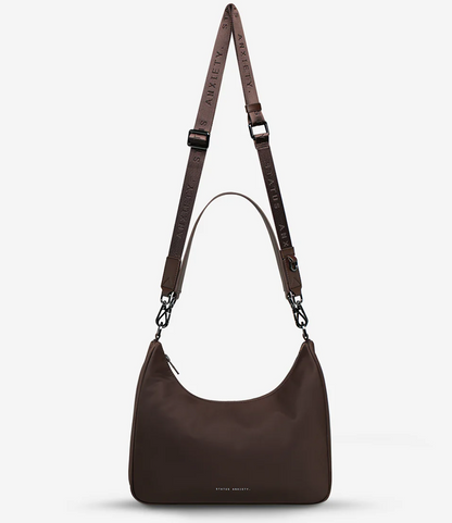 Fleur Recycled Bag - Truffle - Status Anxiety 

Versatile and deceptively roomy. 'Fleur' is made of premium reinforced recycled polyester to give it superior structure, and is finished with our branded zippers and tonal hardware. Comes equipped with dual interchangeable straps: a longer webbed strap for everyday crossbody use, and shorter shoulder strap for a dressier look. 
