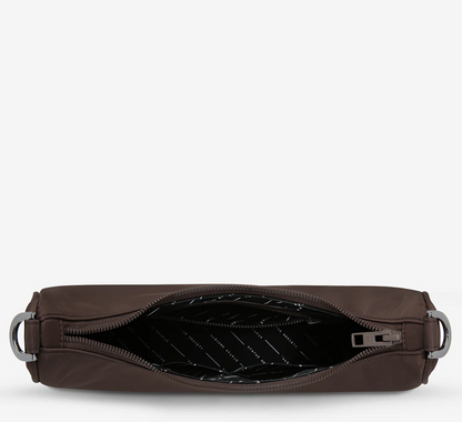 Fleur Recycled Bag - Truffle - Status Anxiety 

Versatile and deceptively roomy. 'Fleur' is made of premium reinforced recycled polyester to give it superior structure, and is finished with our branded zippers and tonal hardware. Comes equipped with dual interchangeable straps: a longer webbed strap for everyday crossbody use, and shorter shoulder strap for a dressier look. 
