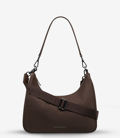 Fleur Recycled Bag - Truffle - Status Anxiety 

Versatile and deceptively roomy. 'Fleur' is made of premium reinforced recycled polyester to give it superior structure, and is finished with our branded zippers and tonal hardware. Comes equipped with dual interchangeable straps: a longer webbed strap for everyday crossbody use, and shorter shoulder strap for a dressier look. 
