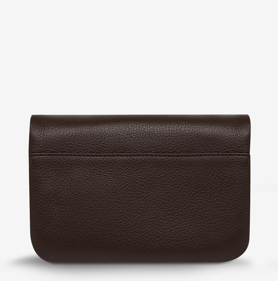 Impermanent Wallet - Cocoa - Status Anxiety 
Nothing lasts forever they say, but we can assure you that the Impermanent wallet is likely to last a bloody long time. Stash your stuff in its relaxed less structured form and slip it into your pocket or handbag.

Soft shrunken pebble leather
Custom Status Anxiety lining
6 card slots (option to double up)
Internal zipper pocket
Magnet close
Gunmetal hardware
Silver foil logo
Comes in a Status Anxiety branded drawstring bag