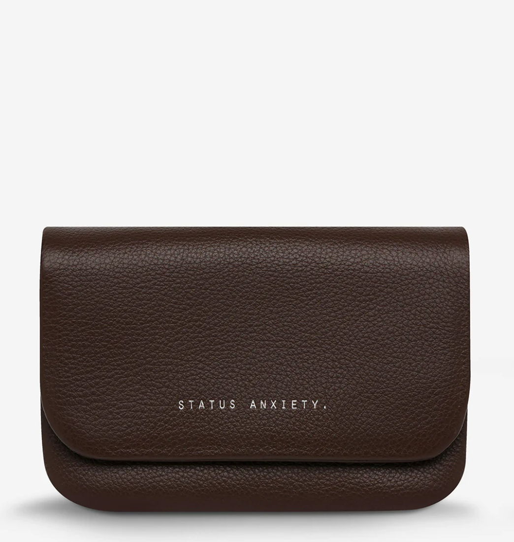 Impermanent Wallet - Cocoa - Status Anxiety 
Nothing lasts forever they say, but we can assure you that the Impermanent wallet is likely to last a bloody long time. Stash your stuff in its relaxed less structured form and slip it into your pocket or handbag.

Soft shrunken pebble leather
Custom Status Anxiety lining
6 card slots (option to double up)
Internal zipper pocket
Magnet close
Gunmetal hardware
Silver foil logo
Comes in a Status Anxiety branded drawstring bag