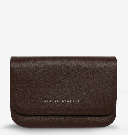Impermanent Wallet - Cocoa - Status Anxiety 
Nothing lasts forever they say, but we can assure you that the Impermanent wallet is likely to last a bloody long time. Stash your stuff in its relaxed less structured form and slip it into your pocket or handbag.

Soft shrunken pebble leather
Custom Status Anxiety lining
6 card slots (option to double up)
Internal zipper pocket
Magnet close
Gunmetal hardware
Silver foil logo
Comes in a Status Anxiety branded drawstring bag