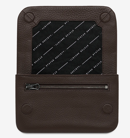 Impermanent Wallet - Cocoa - Status Anxiety 
Nothing lasts forever they say, but we can assure you that the Impermanent wallet is likely to last a bloody long time. Stash your stuff in its relaxed less structured form and slip it into your pocket or handbag.

Soft shrunken pebble leather
Custom Status Anxiety lining
6 card slots (option to double up)
Internal zipper pocket
Magnet close
Gunmetal hardware
Silver foil logo
Comes in a Status Anxiety branded drawstring bag