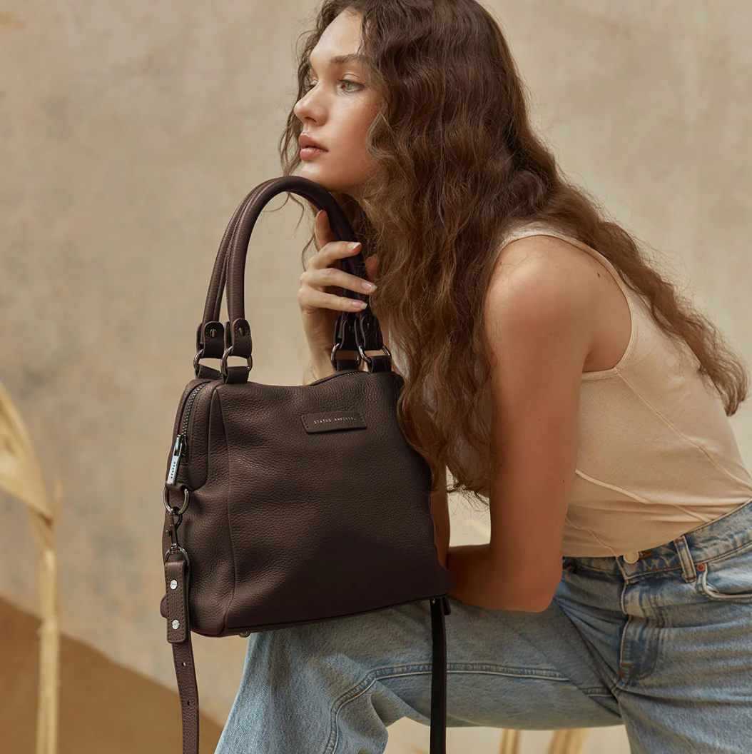 Last Mountains Bag - Cocoa - Status Anxiety 

The final assault to end it, to prevail over the proclivity to someone or something. The Last Mountains handbag with its taller silhouette is the perfect day to night companion and can be worn over elbow, shoulder or body (with long strap). Features a wide-opening main compartment, longer shoulder straps for added comfort and secret magnet-close pocket on the outside for your phone etc.

Soft shrunken pebble leather
Back magnet pocket
Internal zipper pocket