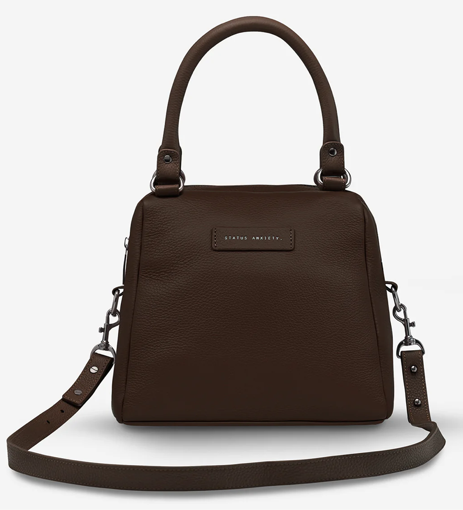 Last Mountains Bag - Cocoa - Status Anxiety 

The final assault to end it, to prevail over the proclivity to someone or something. The Last Mountains handbag with its taller silhouette is the perfect day to night companion and can be worn over elbow, shoulder or body (with long strap). Features a wide-opening main compartment, longer shoulder straps for added comfort and secret magnet-close pocket on the outside for your phone etc.

Soft shrunken pebble leather
Back magnet pocket
Internal zipper pocket